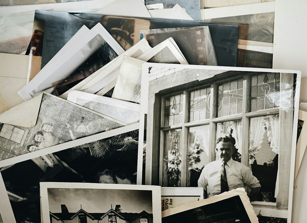Old photographs and documents on a table