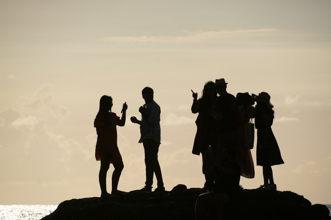 Group portrait of four photographers and journalists