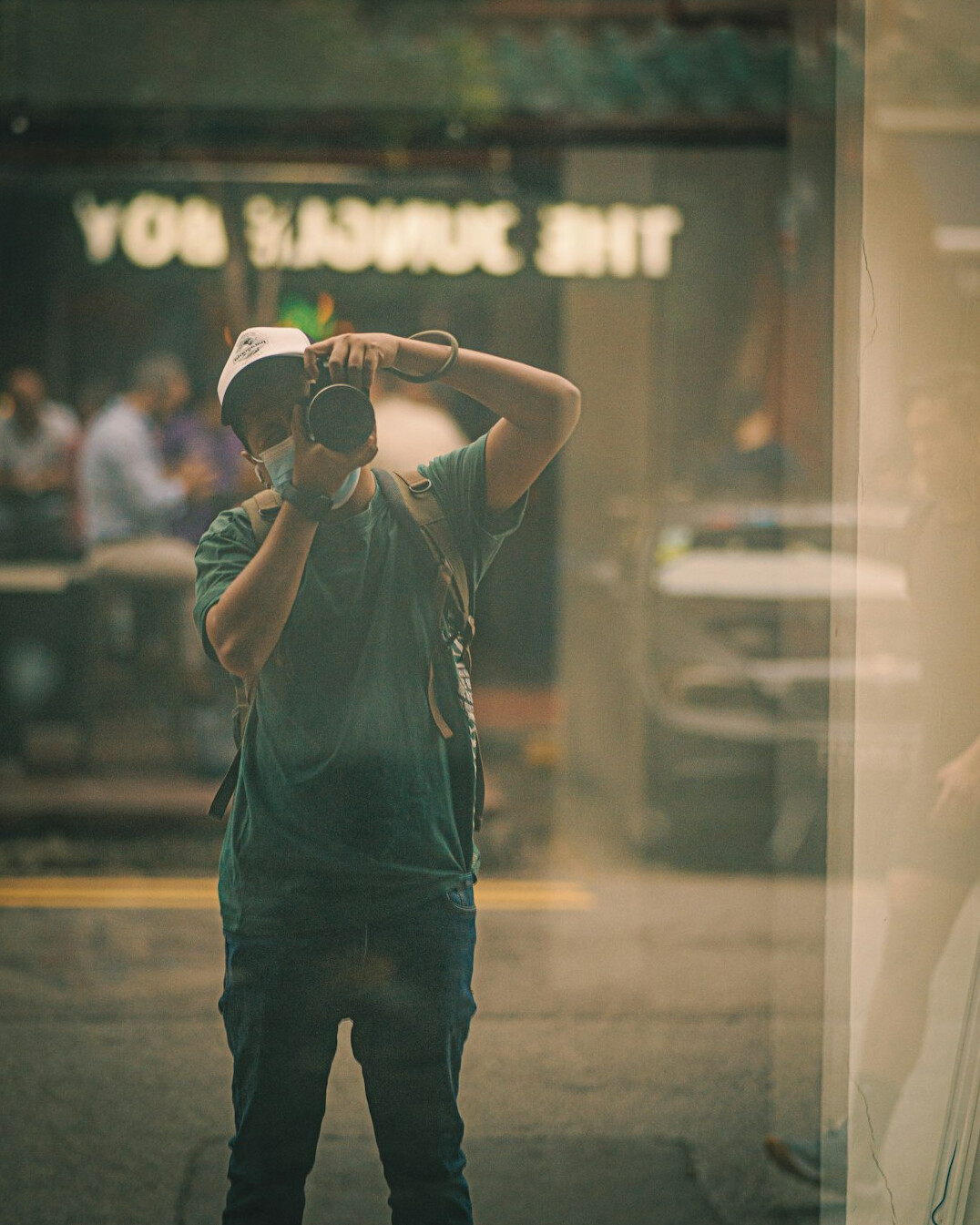 Documentary photographer photographing a street scene